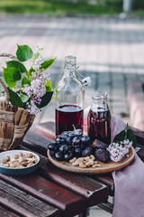 A still life with Grape Juice and Grapes, Cashew Nuts and Dates, Selected Focus
