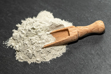 Zeolite mesolite raw powder on black  background