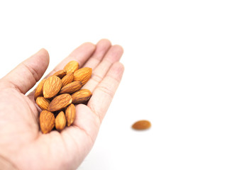 almonds in hand isolated on white