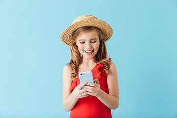 Cheerful little girl wearing swimsuit standing