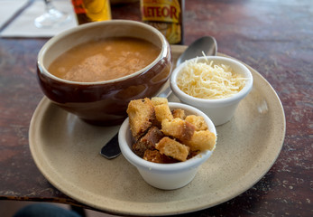 Fish soup with croutons and cheese in Cancale. Brittany, France