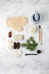 Spa treatment on light background. Spa accessories composition on white table. Natural aroma oil, sea salt, sisal, natural soap. Healthy skin care. SPA, zero waste concept