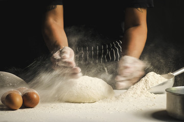 Chef is kneading dough