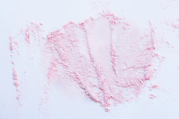Cosmetic powder, swatch on paper, abstract background