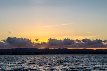 Golden sunsets are the highlight on this beach, Point Chevier, Auckland, New Zealand