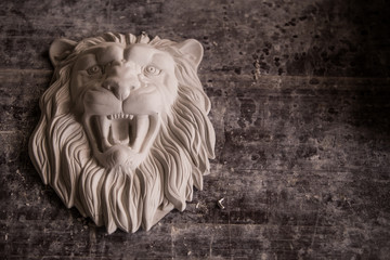 Creation of sculpture from plaster. Lion's head. Plaster workshop. Tooling.