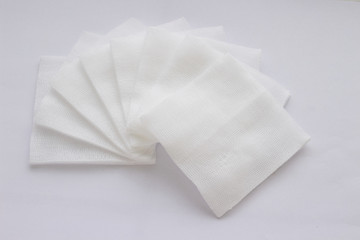 Pile of pad gauzes on white background in fan shape