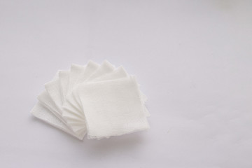 Pile of pad gauzes on white background