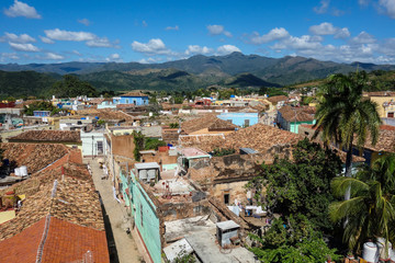 Colorful skyline with mountains and colonial houses. The village is a Unesco World Heritage and major tourist landmark on the Caribbean Island, Trinidad de Cuba