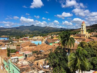 Fototapeta na wymiar Colorful skyline with mountains and colonial houses. The village is a Unesco World Heritage and major tourist landmark on the Caribbean Island, Trinidad de Cuba