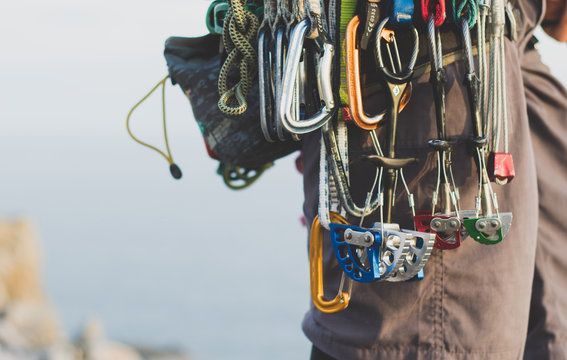Rock climbing gear attached to harness