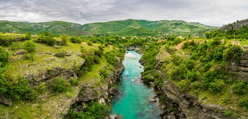Fototapeta na wymiar Montenegro, XXL nature landscape panorama of crystal clear moraca river waters flowing through famous moraca canyon