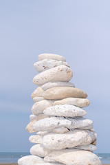 Fototapeta na wymiar Stacked Stones beach in zen pyramid