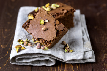 Pieces of Homemade Chocolate Brownies With Nuts Lying on Linen Napkin Vertical Horizontal