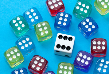 Colorful dices on blue background.