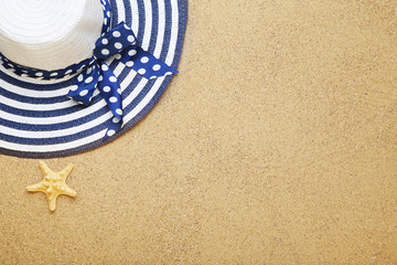Fototapeta na wymiar Beach hat with starfish on sand