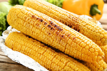 Grilled corn on brown wooden table