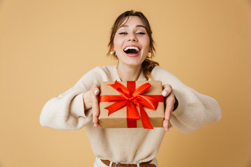 Beautiful young woman wearing sweater standing