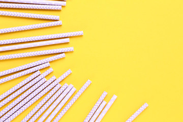 Fototapeta premium Paper straws on yellow background