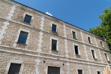 Fototapeta na wymiar facade of a stone building with windows