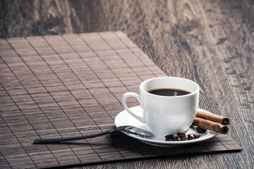Cup of espresso coffee on wooden table
