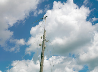Obraz premium electrical post with dandling wires