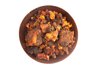 Sweet Myrrh Opoponax in a Wooden Bowl Isolated on a White Background