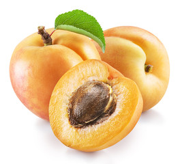 Ripe apricot fruits with green leaf and apricot half. File contains clipping path.