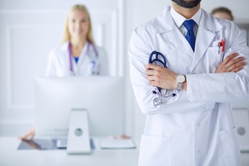 Young male doctor in front of medical group