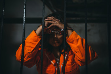 Portrait of women desperate to catch the iron prison,prisoner concept,thailand people,Hope to be...