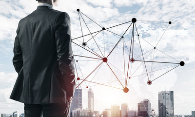 Concept of business success and control with confident boss against cityscape background