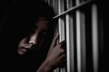 Hands of women desperate to catch the iron prison,prisoner concept,thailand people,Hope to be...