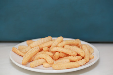 Closeup Shrimp cracker chips on a white paper plate. - Image