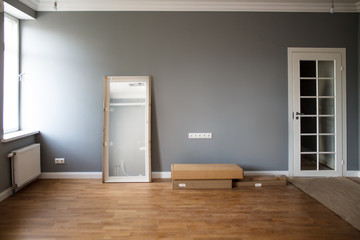 the interior of the room after finishing the repair of the lilac walls without furniture