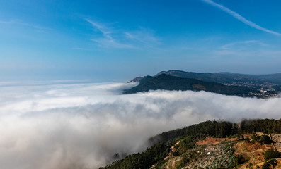 view of mountains with fog