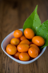 Orange kumquats with leaves