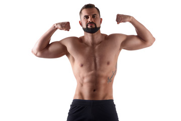 Fototapeta na wymiar Handsome muscular man on isolated background shows his body. Sportsmans body. Sport concept
