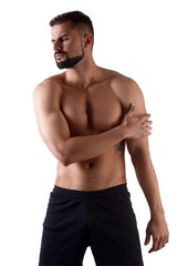 Fototapeta premium Muscular strong man with shoulder pain, isolated on white background