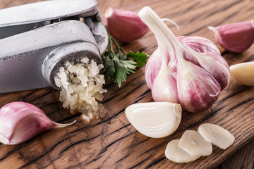 Garlic bulb and garlic cloves  on the wooden table.