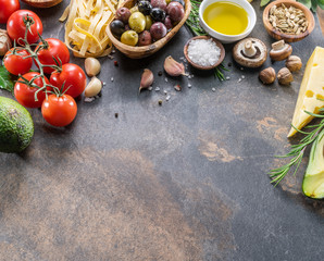 Pasta, spices and vegetables. Popular mediterranean or italian food ingredients.