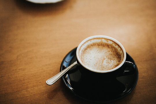Cappuccino on wooden table