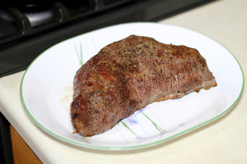 Sirloin tritip steak on a plate.