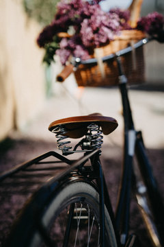Bicycle with with fresh bread and flowers in a basket