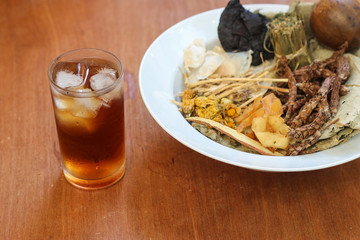 Bowl full of dried Chinese mixed herbs to make cooling drinks. Chinese herbal medicine with ingredient.