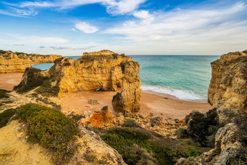 Fototapeta na wymiar Beautiful cliffy beach in Albufeira, Algarve, Portugal