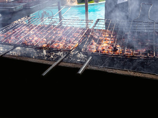 Grilled meat roasted skewers barbecue. Barbeque churrasco meat background. Appetizing meat roasted BBQ grill outdoor