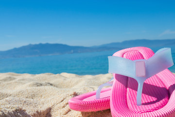 sandals in the sand of the beach