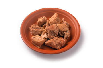 Fried pork, large pieces, full of dishes Big slices of deep fried pork in a ceramic plate, isolated on white background