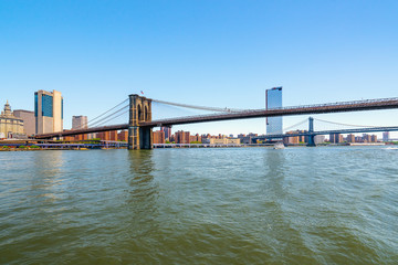 Brooklyn Bridge and Manhattan Bridge in New York City. Boat Tour Journey