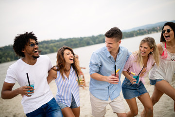 Happy people having fun in summer holidays. Friends, vacation, summer lifestyle and youth concept
